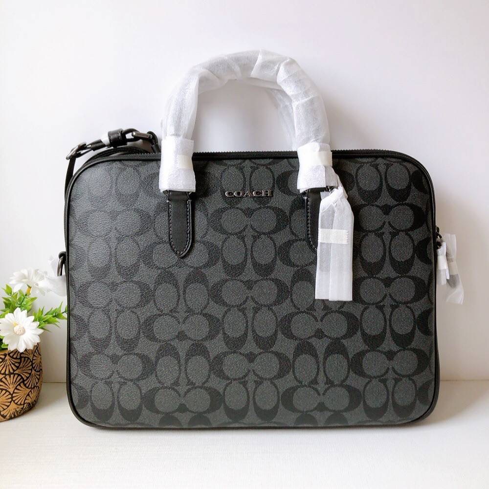 NEW COACH CJ630 LIAM COMPACT BRIEF IN SIGNATURE CANVAS CANVAS COLOR: CHARCOAL SIZE: 13" (L) x 9 3/4" (H) x 1" (W)