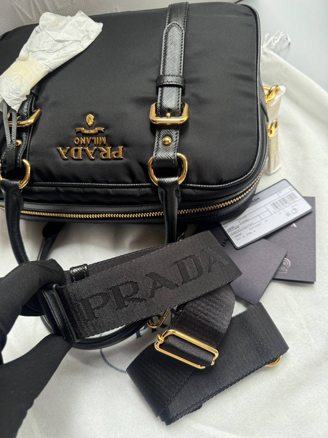 New Prada Tessuto + Saffiano Bauletto Bag • Size : 10” (L) x 7.5” (H) x 3.5” (D)