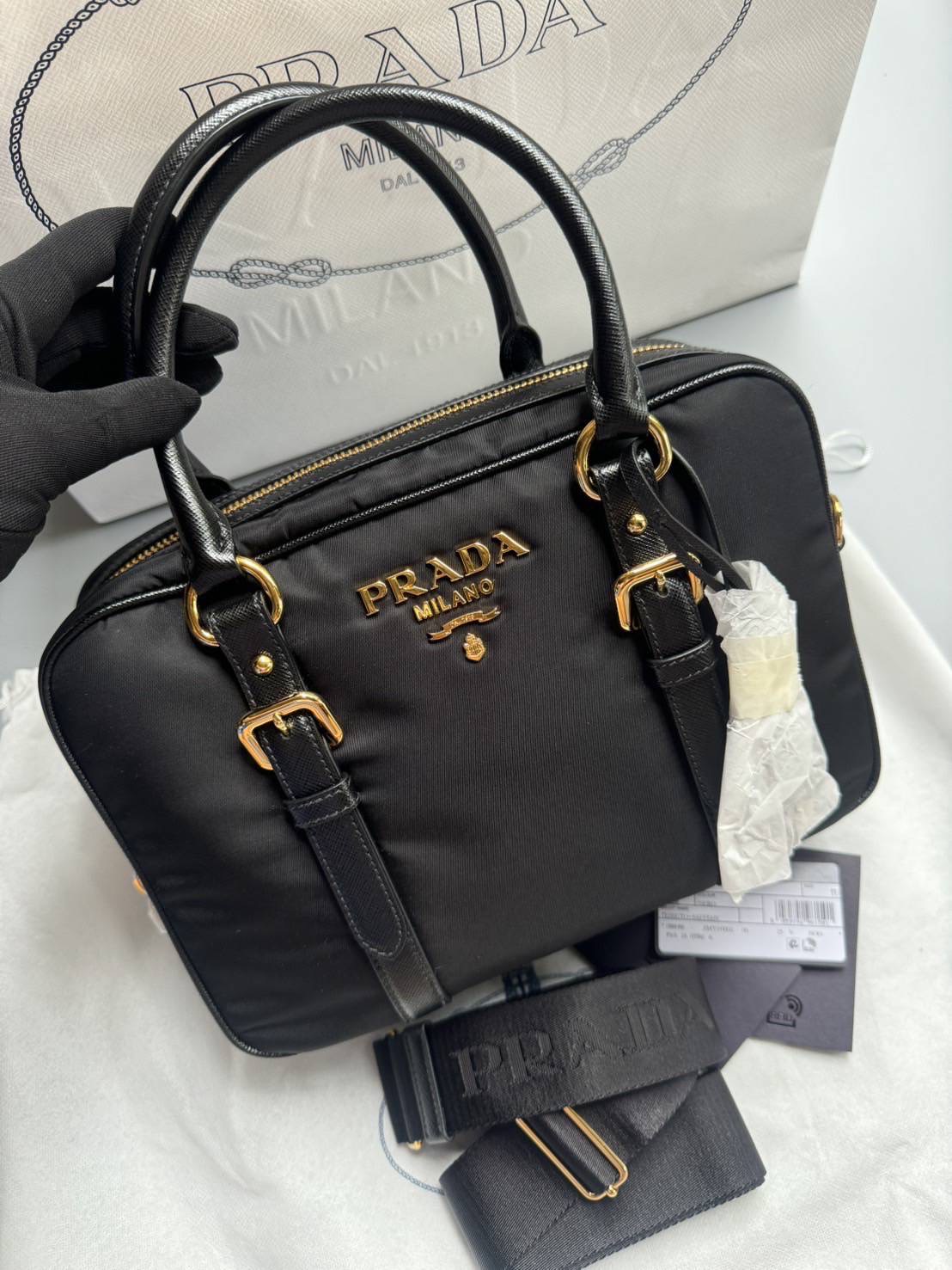 New Prada Tessuto + Saffiano Bauletto Bag • Size : 10” (L) x 7.5” (H) x 3.5” (D)