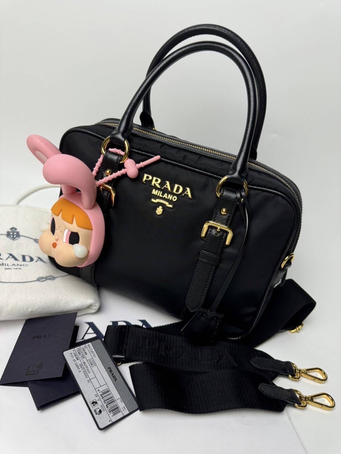 New Prada Tessuto + Saffiano Bauletto Bag • Size : 10” (L) x 7.5” (H) x 3.5” (D)