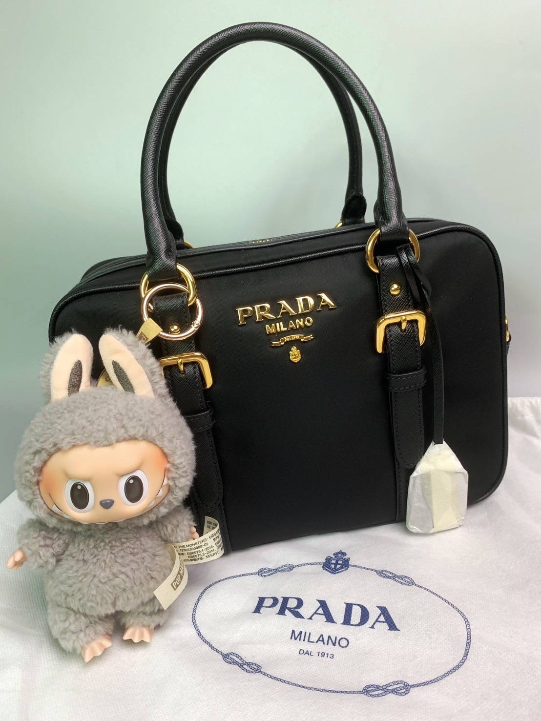 New Prada Tessuto + Saffiano Bauletto Bag • Size : 10” (L) x 7.5” (H) x 3.5” (D)